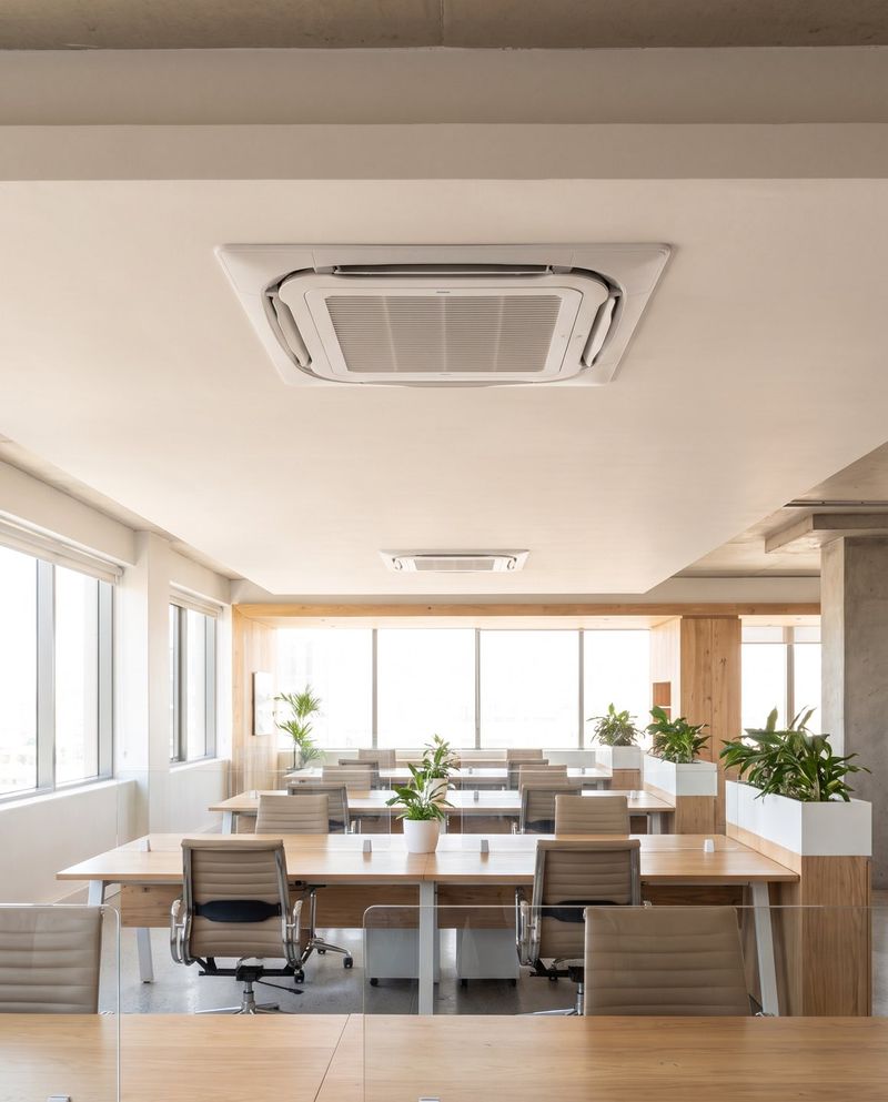 A ceiling cassette unit in an open-plan corporate office